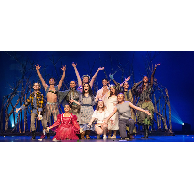 Cast with arms raised