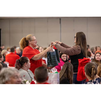 A guest, right, claims their prize.