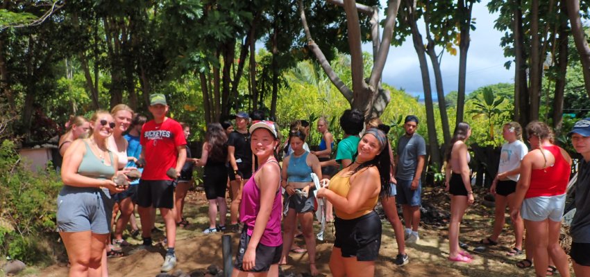 Cortland students working outdoors in Hawaii with the Ecotourism program.