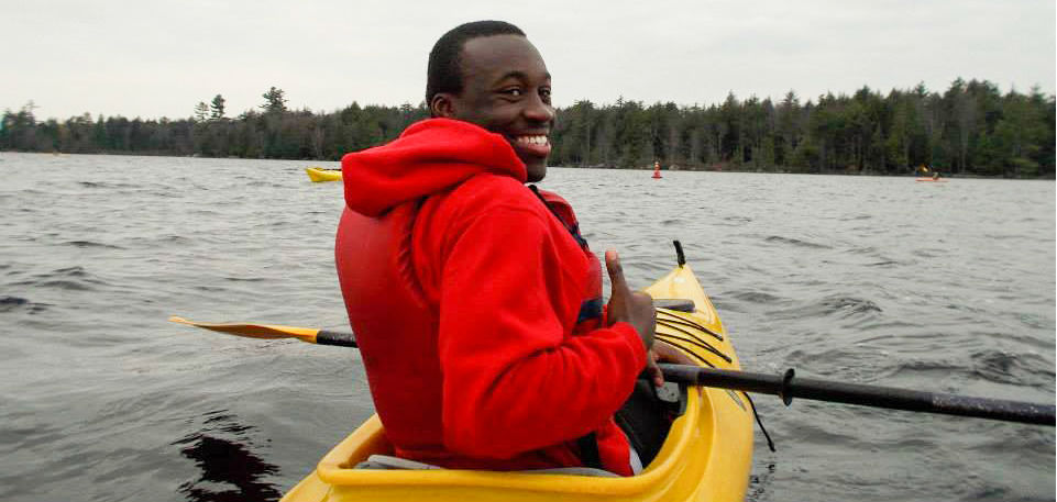 Male student canoeing