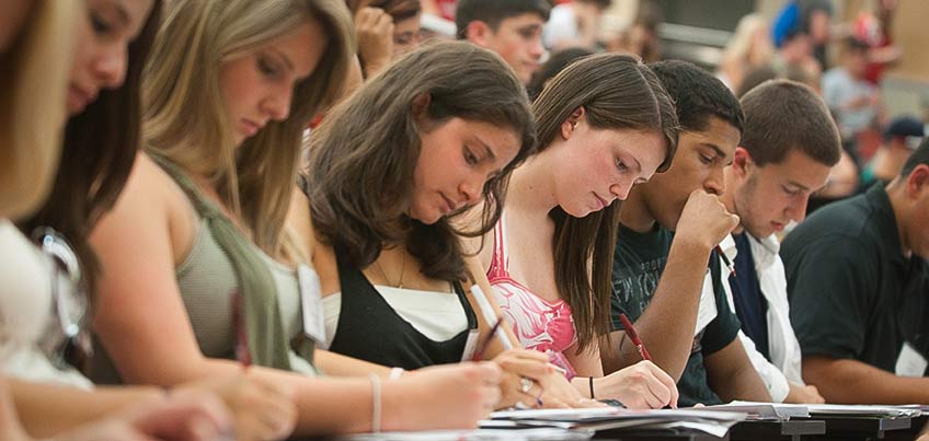 Students taking notes in class