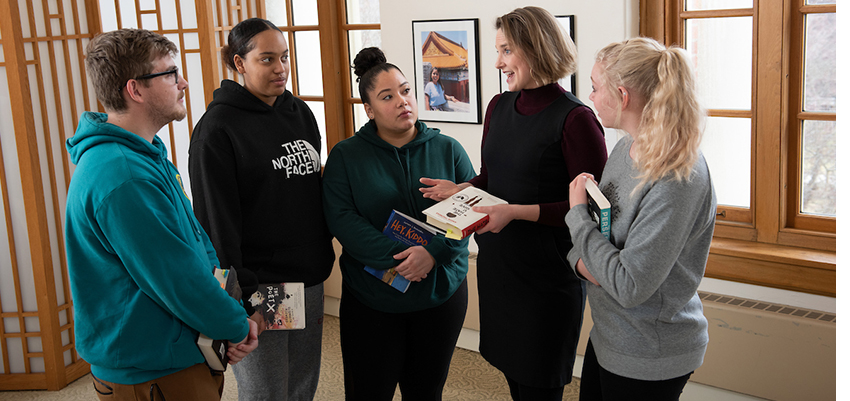 students talking with professor