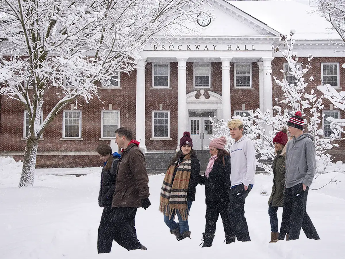 Winter tour walking in front of Brockway Hall