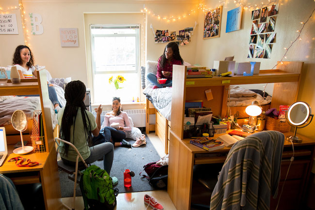 Students talking in a bedroom in Cheney Hall