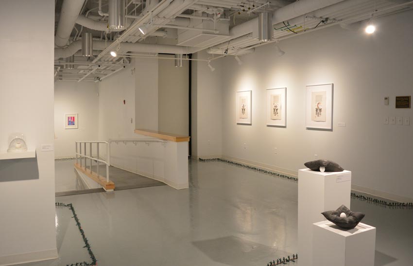  View into the central gallery at Dowd Gallery featuring sculptural objects produced by Jaroslava Prihodova, director of the Dowd Gallery, Jenn McNamara, professor of fiber arts, Szilvia Kadas, professor of graphic design, and installation by Bryan Valentine Thomas, instructor of design and drawing, at the Art and Art History Department.  