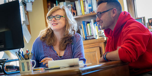 faculty member working with student