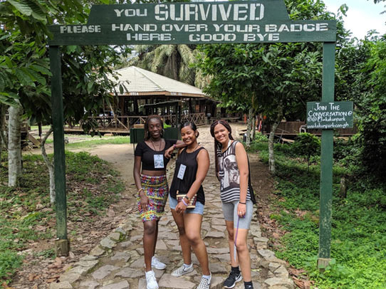 Students standing in front of exit gate in Ghana