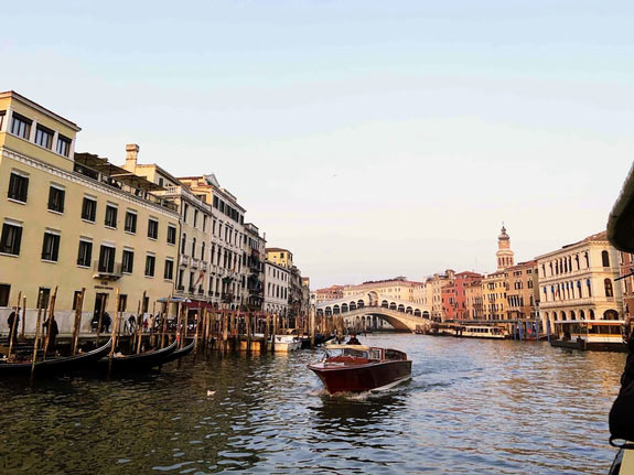 Canal with boat in Venice, Italy