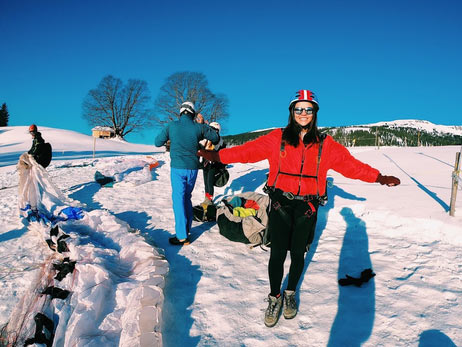 Student preparing to hang glide in sunny Switzerland