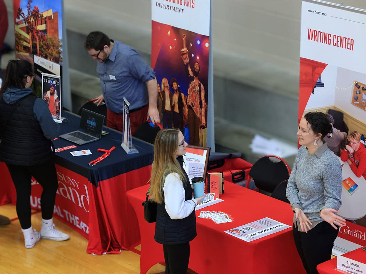 Prospective students asking questions at Open House